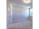 Cozy bedroom with carpet, large window, and closet at 229 Gilliland Rd, Siler City, NC 27344