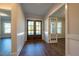 Inviting foyer features wood floors, wainscoting, and a stunning front door at 229 Gilliland Rd, Siler City, NC 27344