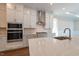 Modern kitchen features a large island, white cabinets, and stainless steel appliances at 229 Gilliland Rd, Siler City, NC 27344