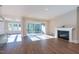 Spacious living room with fireplace, recessed lighting, and sliding doors to the screened deck at 229 Gilliland Rd, Siler City, NC 27344