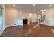 Open living space with modern fireplace, recessed lighting, and hardwood floors at 229 Gilliland Rd, Siler City, NC 27344