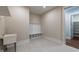 Convenient mudroom with bench, coat hooks, and tile flooring at 229 Gilliland Rd, Siler City, NC 27344