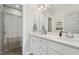This is a clean and bright bathroom with double sinks and granite countertops at 233 Airlie Dr, Chapel Hill, NC 27516