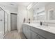 Stylish bathroom with dual sink vanity, gray cabinets, and a glass-enclosed shower at 233 Airlie Dr, Chapel Hill, NC 27516