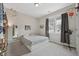 Well-lit bedroom with a large window, gray curtains, and fun decorative accents at 233 Airlie Dr, Chapel Hill, NC 27516