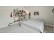 Bright bedroom featuring a built-in bookcase, large window, and neutral decor at 233 Airlie Dr, Chapel Hill, NC 27516