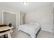 This bedroom has gray carpet and walls plus a double door closet at 233 Airlie Dr, Chapel Hill, NC 27516