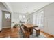 Well-lit dining room showcasing a wooden table with bench seating and wainscoting details throughout at 233 Airlie Dr, Chapel Hill, NC 27516