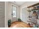 Inviting foyer boasts hardwood floors, a decorative bookcase, and plenty of natural light at 233 Airlie Dr, Chapel Hill, NC 27516