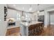 Modern kitchen featuring white cabinets, a large island with seating, and stainless steel appliances at 233 Airlie Dr, Chapel Hill, NC 27516