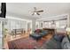 Open-concept living room flows into the dining and kitchen areas with hardwood floors at 233 Airlie Dr, Chapel Hill, NC 27516