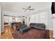 Spacious living room with hardwood floors and open layout to the kitchen and dining areas at 233 Airlie Dr, Chapel Hill, NC 27516
