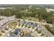 Aerial view showcases a residential neighborhood nestled near expansive green spaces at 237 Begen St, Morrisville, NC 27560