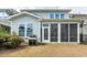 Backyard view of the home, highlighting the screened-in porch and outdoor grill area at 237 Begen St, Morrisville, NC 27560
