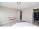 Bedroom with a desk, carpet, and closet, providing a functional and comfortable space at 237 Begen St, Morrisville, NC 27560