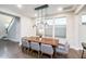 Elegant dining area featuring modern chandelier lighting and ample natural light at 237 Begen St, Morrisville, NC 27560