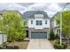 Charming two-story home with a gray roof, stone accents, and a well-manicured front yard at 237 Begen St, Morrisville, NC 27560