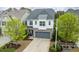 Charming home with a two-car garage, stone accents, and a well-manicured lawn at 237 Begen St, Morrisville, NC 27560