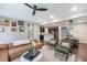 Open-concept living room with hardwood floors, comfortable seating, and views into the kitchen at 237 Begen St, Morrisville, NC 27560