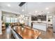 Open-concept living space featuring a dining area, kitchen, and living room with hardwood floors at 237 Begen St, Morrisville, NC 27560