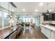 Open-concept living space featuring a dining area, kitchen, and living room with hardwood floors at 237 Begen St, Morrisville, NC 27560