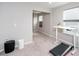 Versatile room with treadmill and an adjustable desk, perfect for a home office or workout area at 237 Begen St, Morrisville, NC 27560