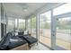 Cozy sunroom with comfortable seating, a ceiling fan, and views of the backyard at 237 Begen St, Morrisville, NC 27560