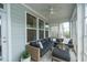 Charming sunroom with wicker furniture, patterned tile flooring, and plenty of natural light at 237 Begen St, Morrisville, NC 27560
