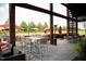 Outdoor patio featuring tables, chairs, and red umbrellas at 2401 Whitewing Ln, Wendell, NC 27591