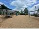 Outdoor playground area with wooden play structures, swings, and picnic tables at 2401 Whitewing Ln, Wendell, NC 27591