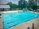 Large outdoor pool with slide and splash pad, perfect for swimming and Gathering fun at 2401 Whitewing Ln, Wendell, NC 27591