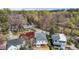 Nice aerial view featuring a home with a gray roof, landscaping, and a serene residential street at 2605 Hazelwood Dr, Raleigh, NC 27608