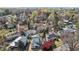 Scenic aerial view of a residential neighborhood surrounded by lush trees, featuring diverse home styles and landscaping at 2605 Hazelwood Dr, Raleigh, NC 27608