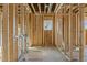 Unfinished bathroom with framing shows the location of the plumbing and window at 2605 Hazelwood Dr, Raleigh, NC 27608