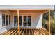 Partially built wooden deck with white sliding glass doors to the new home at 2605 Hazelwood Dr, Raleigh, NC 27608
