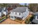 Newly built home with gray siding, a gray roof, and a deck under construction in the backyard at 2605 Hazelwood Dr, Raleigh, NC 27608