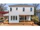Exterior of new construction home, showcasing light gray siding and a partially built wooden deck at 2605 Hazelwood Dr, Raleigh, NC 27608