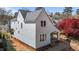 View of a charming two-story home featuring light-colored siding, black trim windows, and an inviting covered entryway at 2605 Hazelwood Dr, Raleigh, NC 27608