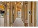 View down hallway with wood framing shows design and construction details at 2605 Hazelwood Dr, Raleigh, NC 27608