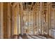 Partially framed interior of a home under construction with exposed plumbing and wood framing, awaiting further work at 2605 Hazelwood Dr, Raleigh, NC 27608