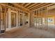 Unfinished interior showcasing exposed wood framing, creating a sense of spaciousness and potential at 2605 Hazelwood Dr, Raleigh, NC 27608