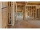 Unfinished interior showcasing exposed wood framing, creating a sense of spaciousness and potential at 2605 Hazelwood Dr, Raleigh, NC 27608