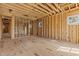 Spacious room with wooden framework, showing construction details, and natural light at 2605 Hazelwood Dr, Raleigh, NC 27608