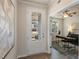 Bright foyer with a glass-paneled front door and a view into the adjacent office space at 279 Providence Creek Dr, Fuquay Varina, NC 27526