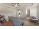 Comfortable main bedroom with neutral colors, a ceiling fan, and a view into the bathroom and hallway at 279 Providence Creek Dr, Fuquay Varina, NC 27526