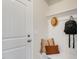 Cozy mudroom with hooks, bench seating, and decorative pillows, offering practical storage at 279 Providence Creek Dr, Fuquay Varina, NC 27526