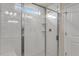 Modern bathroom shower with white subway tiles, a glass door, and sleek chrome fixtures at 279 Providence Creek Dr, Fuquay Varina, NC 27526