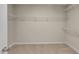 Spacious walk-in closet with ample shelving and carpeted flooring at 279 Providence Creek Dr, Fuquay Varina, NC 27526