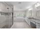 Luxury main bathroom with double vanity, soaking tub, and walk-in shower at 2909 Timpani Trl, Apex, NC 27539