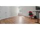 Versatile bedroom space features a window, hardwood floors, and a closet at 2909 Timpani Trl, Apex, NC 27539